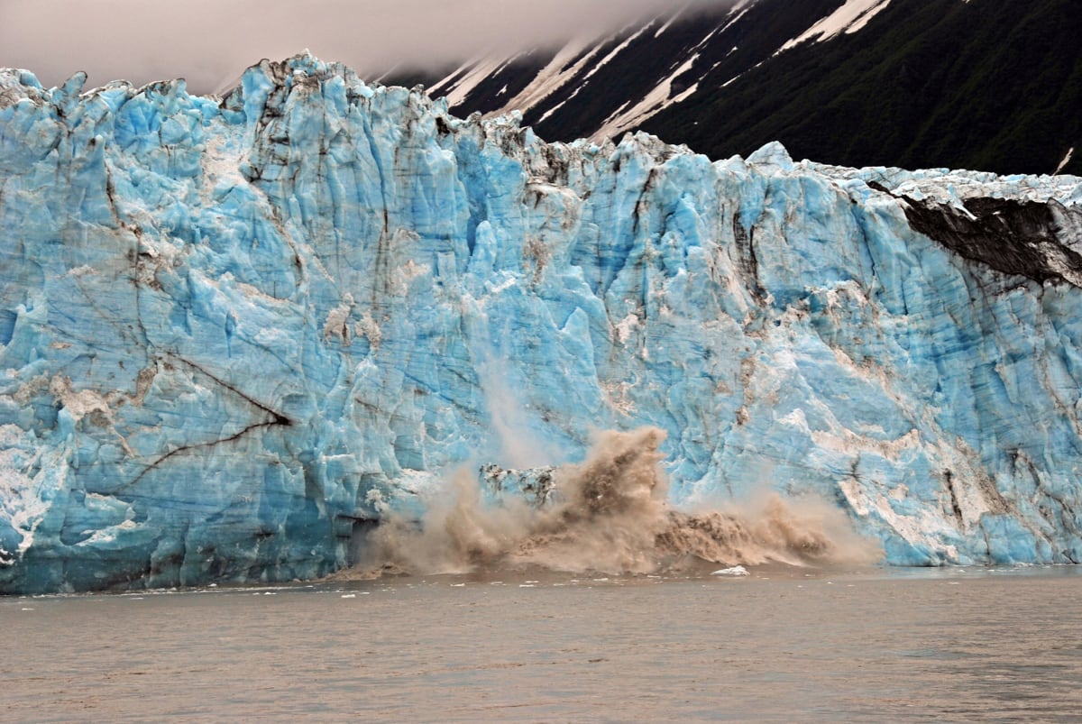 Glacier with ice calving into ocean