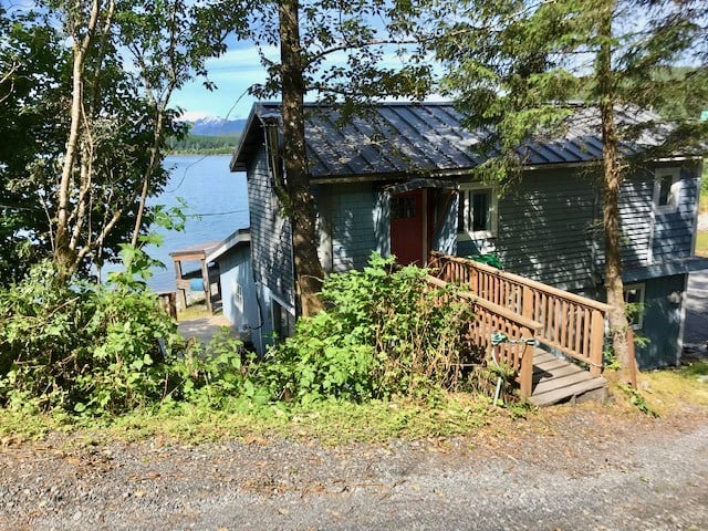 View of cabin with footbridge to front door