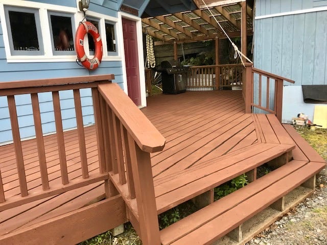 Covered front deck with BBQ grill and covered area