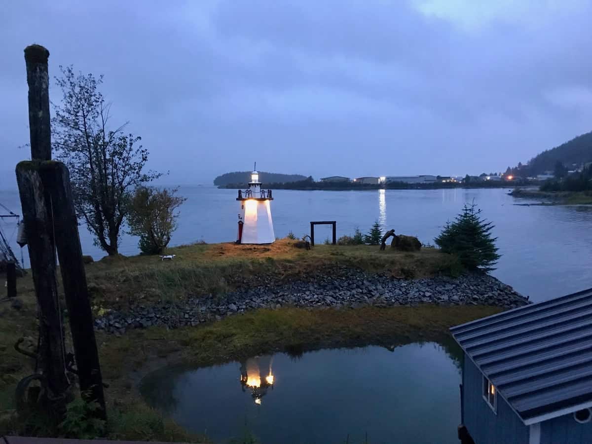 Night-time view of lighthouse and bay